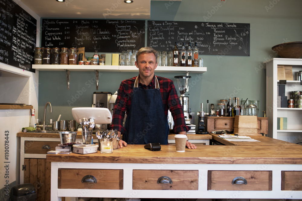 Portrait Of Owner Standing In Coffee Shop Portrait Of Owner Standing In Coffee Shop