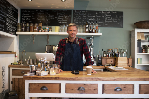  Portrait Of Owner Standing In Coffee Shop 