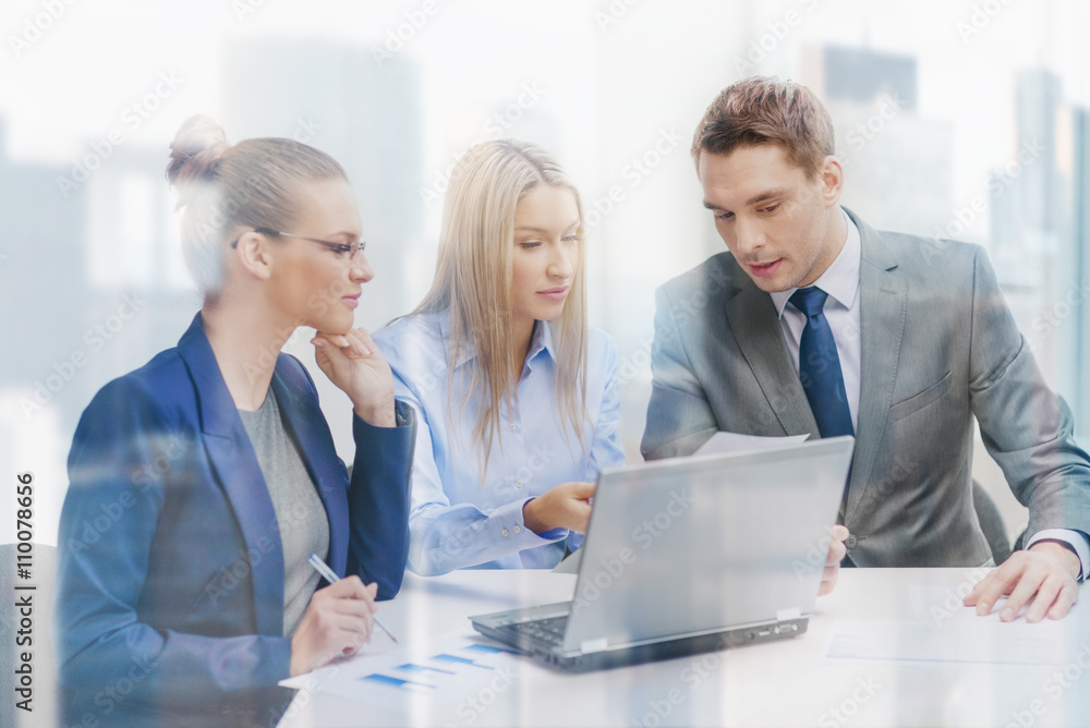 business team with laptop having discussion business team with laptop having discussion