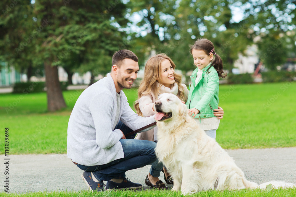 Fototapeta premium happy family with labrador retriever dog in park