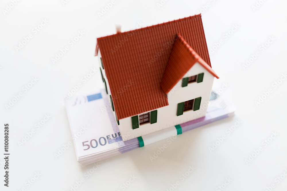 close up of home or house model and money close up of home or house model and money