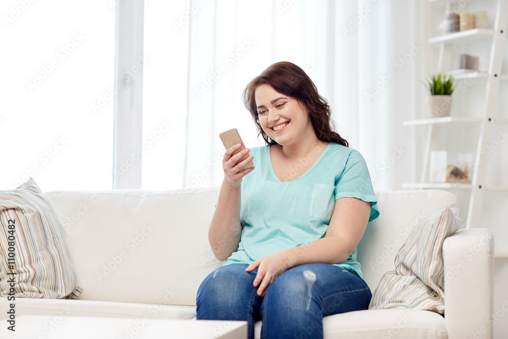 happy plus size woman with smartphone at home happy plus size woman with smartphone at home