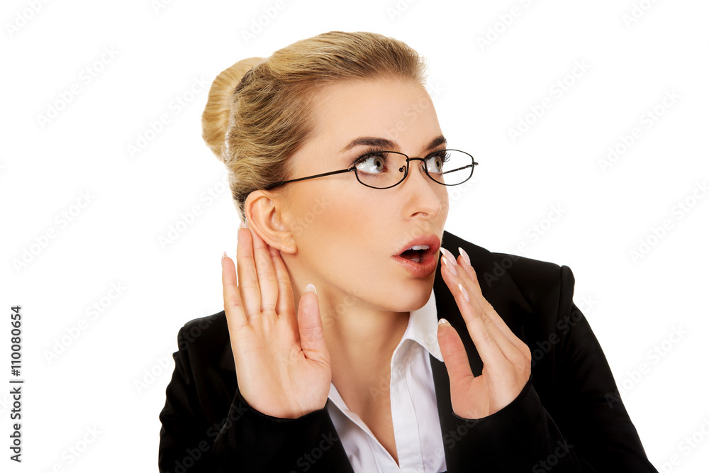 Young businesswoman overhears a conversation. Young businesswoman overhears a conversation.