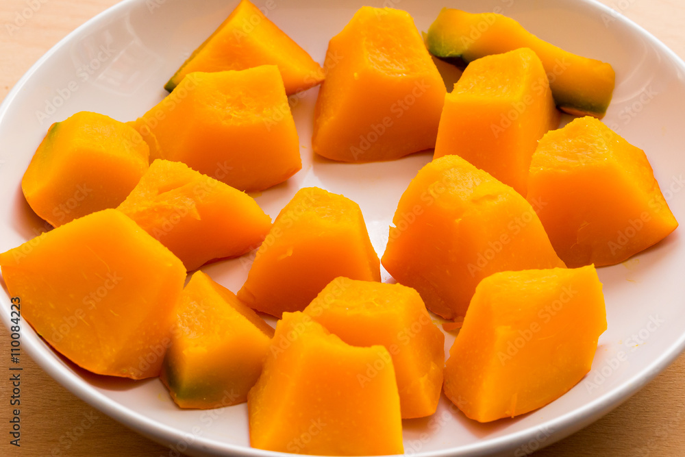 Slices of boiled pumpkin on white dish Slices of boiled pumpkin on white dish