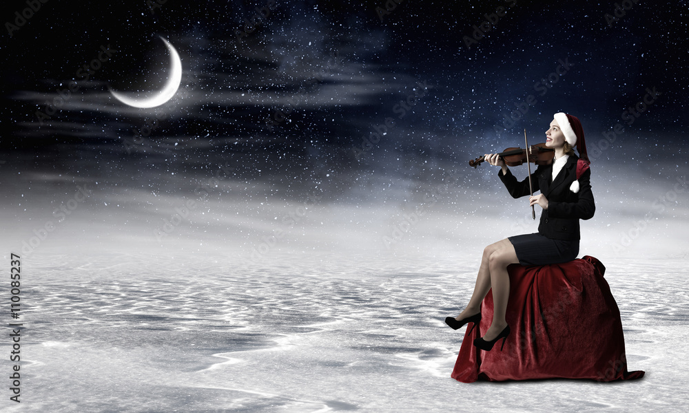 Obraz premium Santa woman play violin