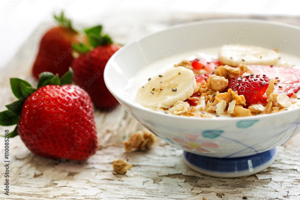 Breakfast yogurt bowl with strawberries, selective focus Breakfast yogurt bowl with strawberries, selective focus