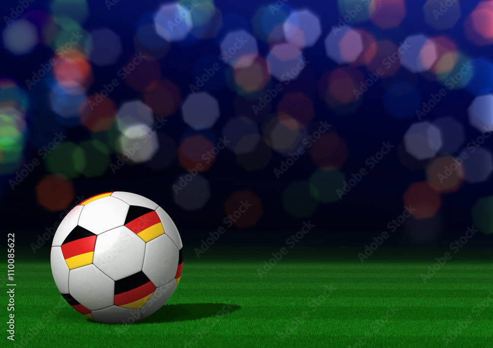 Fußball mit Deutschlandfahne auf Rasen