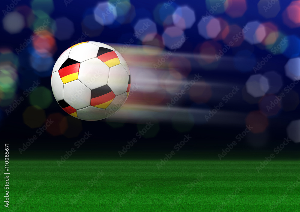 Fototapeta premium Fliegender Fußball mit Deutschlandfahne