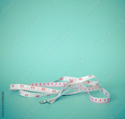 body measurement tape isolated on blue 