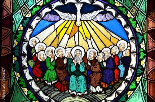 stained glass window depicting Pentecost