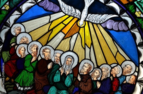 stained glass window depicting Pentecost