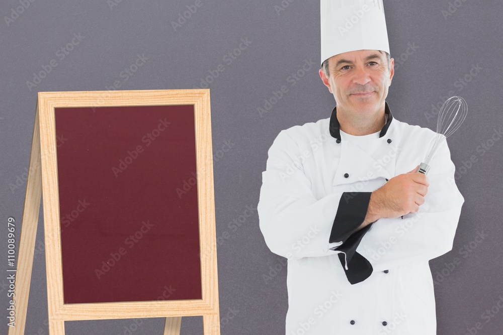 Composite image of a cook posing with his arms crossed Composite image of a cook posing with his arms crossed