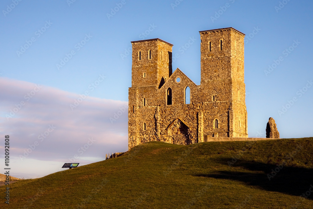 Remains of Reculver church towers bathed in late afternoon sun in winter Remains of Reculver church towers bathed in late afternoon sun in winter
