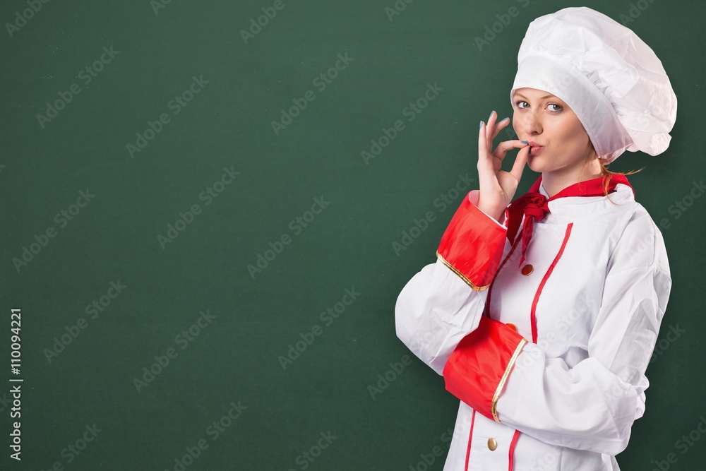 Composite image of pretty chef standing with arms crossed