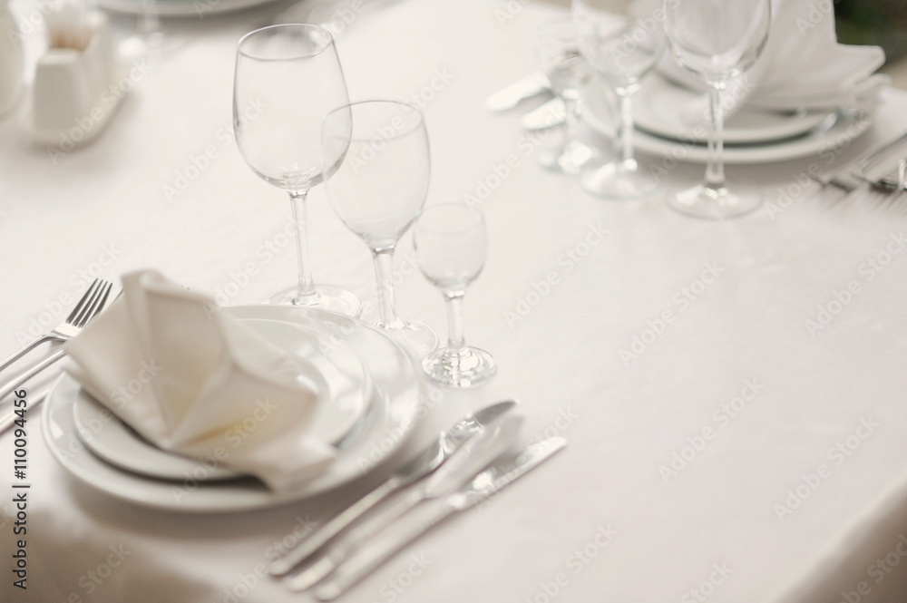 Served table in restaurant with dishes and glasses Served table in restaurant with dishes and glasses
