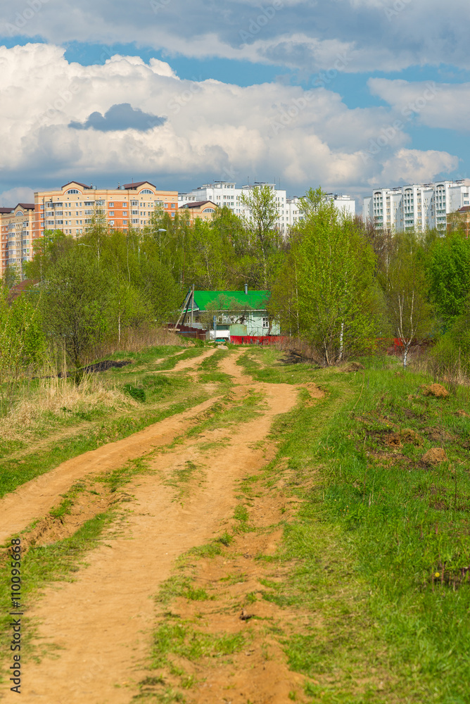 Rural house on background of the city