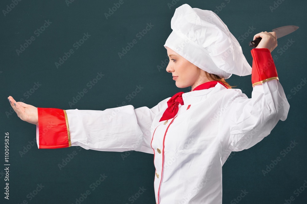 Composite image of pretty chef slicing with knife Composite image of pretty chef slicing with knife