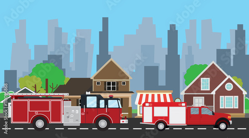 firefighters truck on the way with city home as background