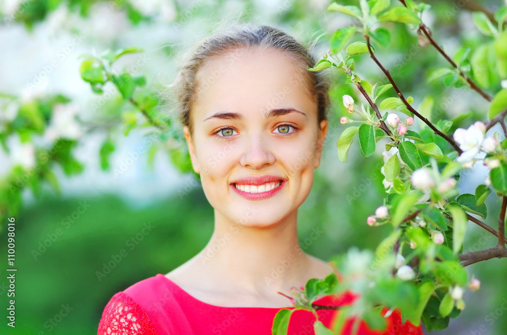 Portrait of cute smiling girl in spring garden Portrait of cute smiling girl in spring garden
