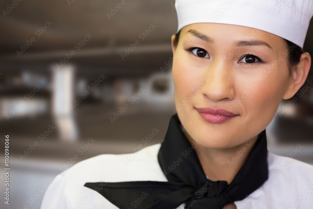 Composite image of closeup portrait of a smiling female cook Composite image of closeup portrait of a smiling female cook