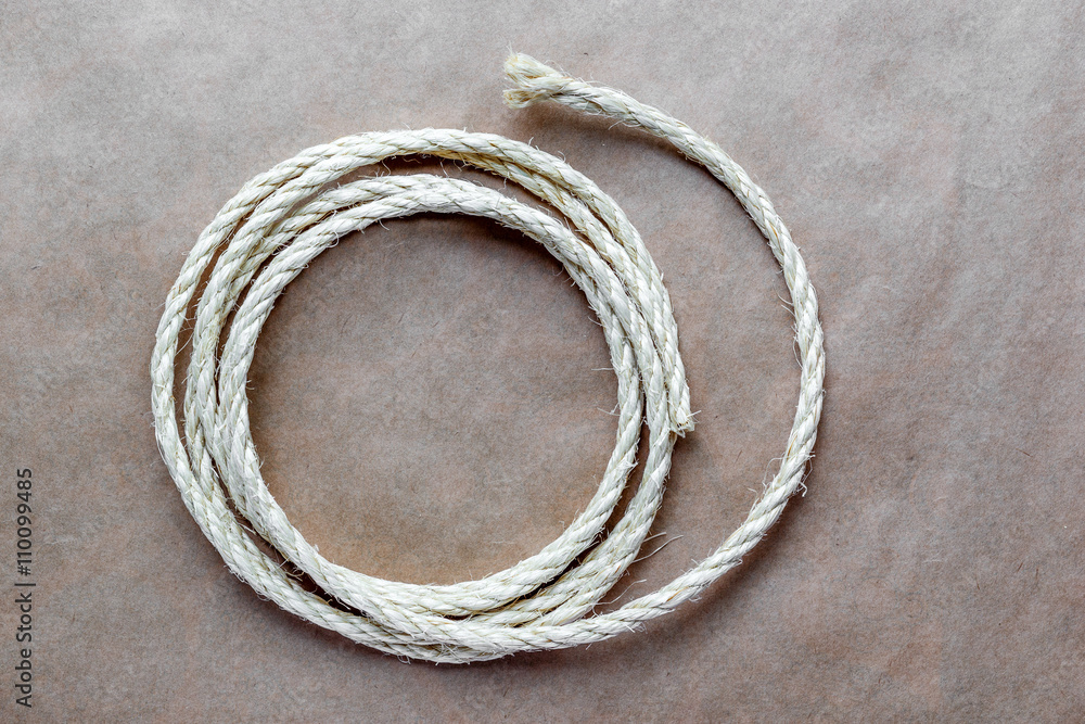 rope coiled at kraft paper on the background