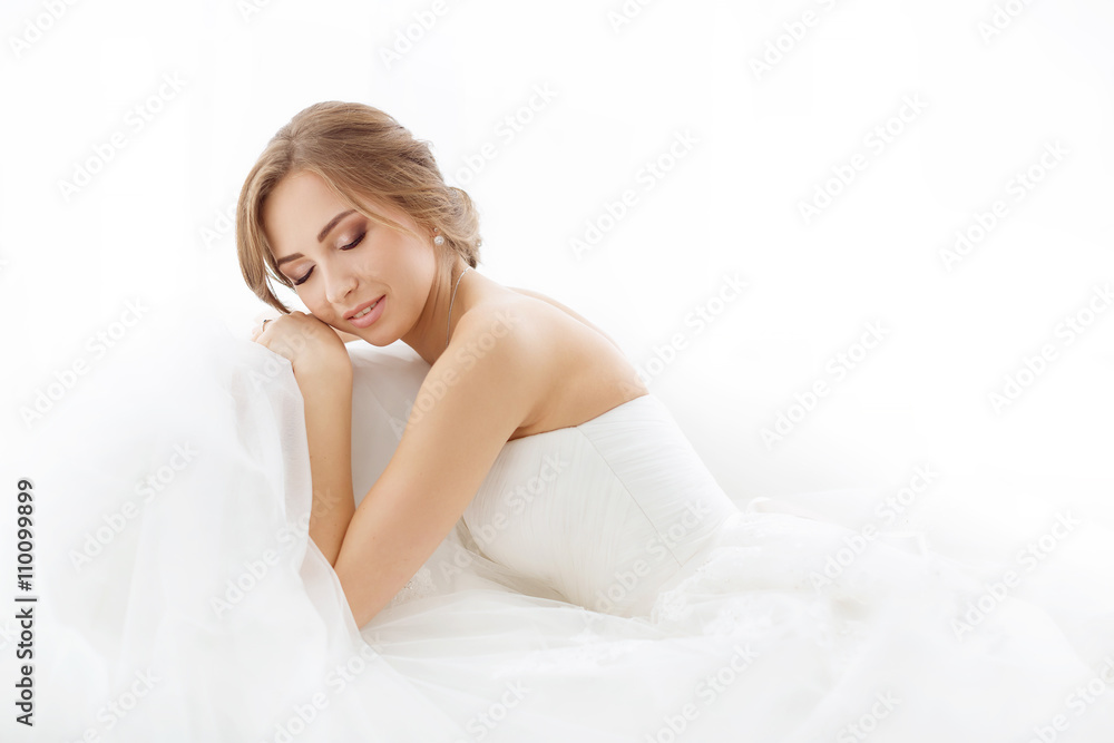Brides beauty. Young woman in wedding dress indoors Brides beauty. Young woman in wedding dress indoors