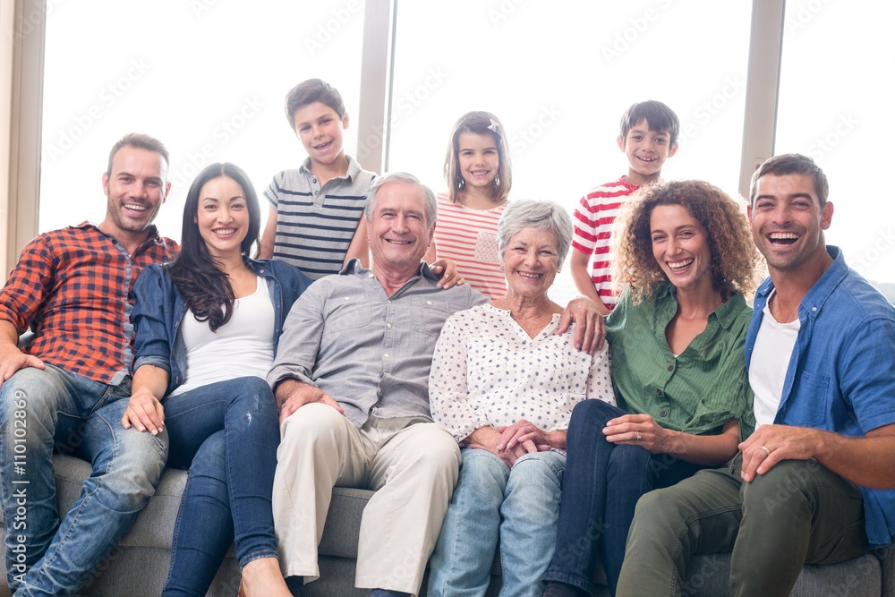 Happy family sitting on sofa