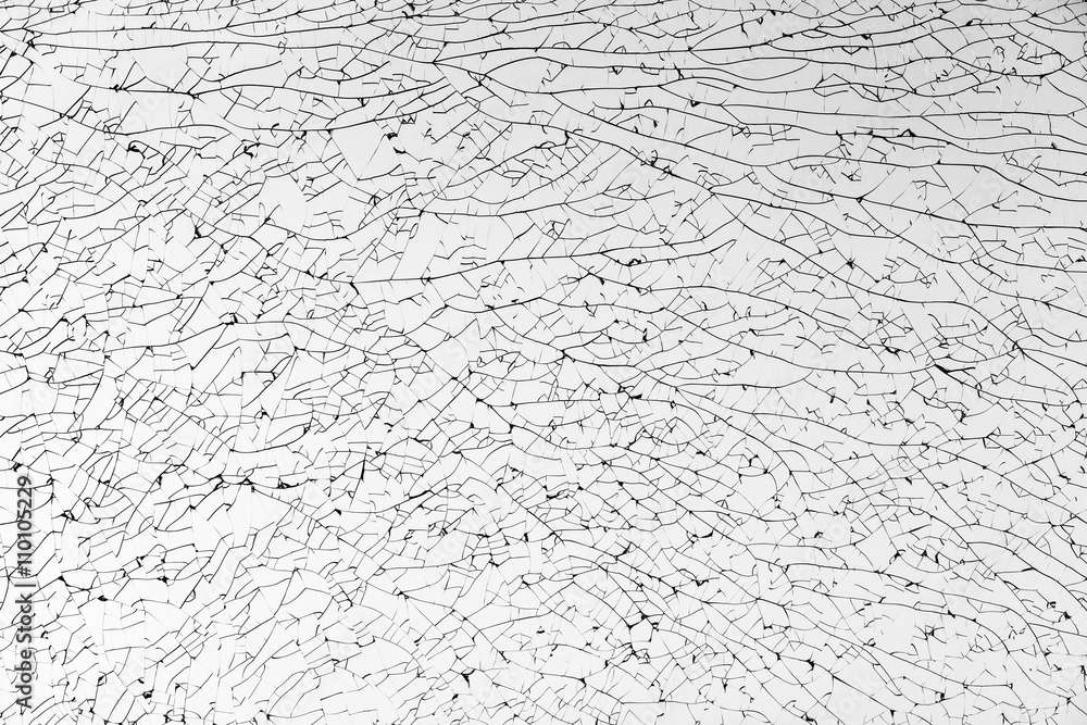Broken glass with cracks pattern, monochrome photo Broken glass with cracks pattern, monochrome photo