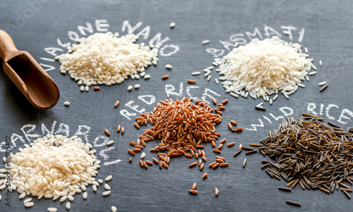 Different kinds of rice on the dark background