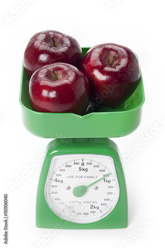 close up of apples being weighed