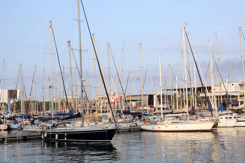 motorboats and yachts in harbour on the sunset