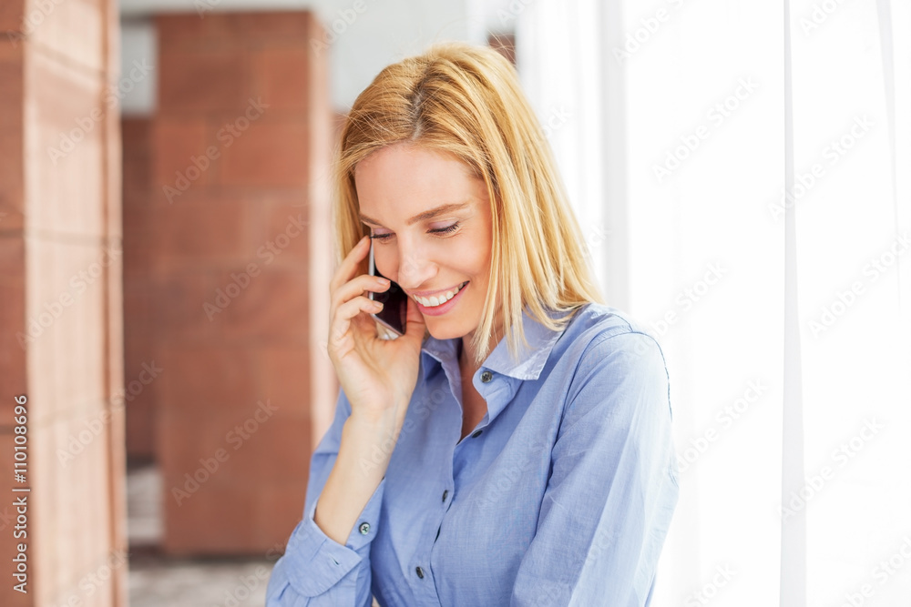 Beautiful young woman in office hall Beautiful young woman in office hall
