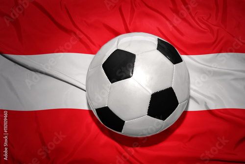 black and white football ball on the national flag of austria