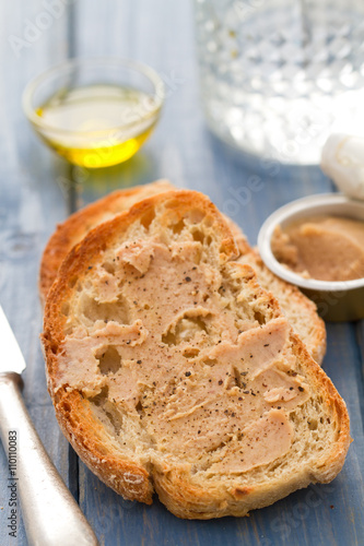 bread with fish pate on blue background