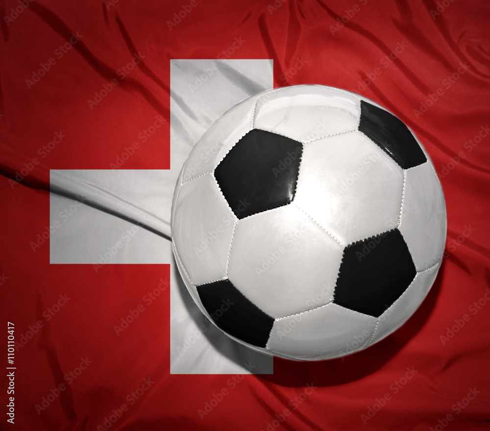 black and white football ball on the national flag of switzerland black and white football ball on the national flag of switzerland