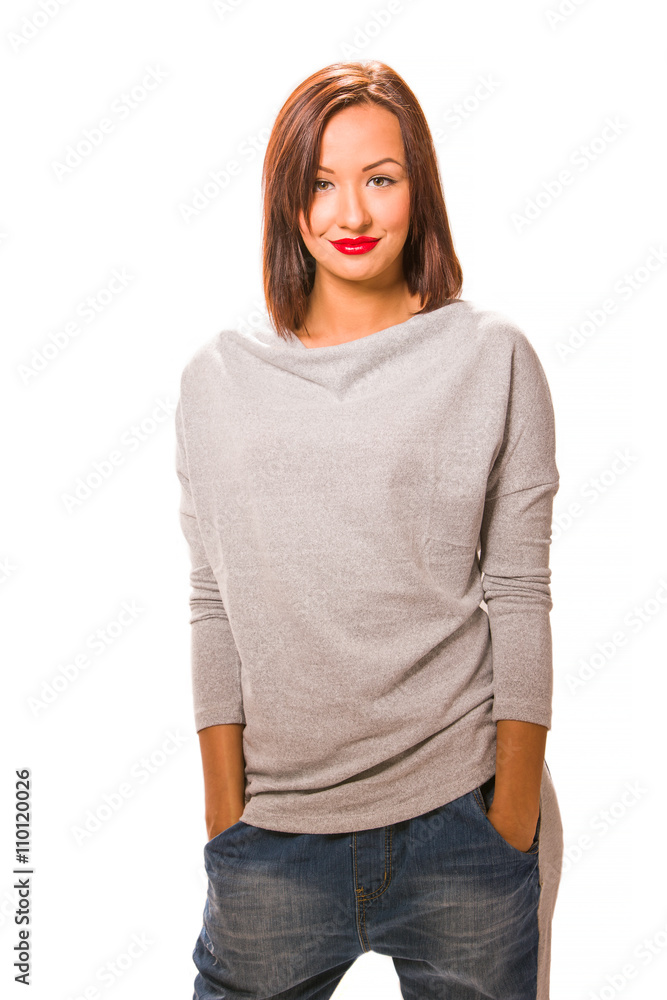 Fototapeta premium Beautiful happy young woman standing with hands in pockets.