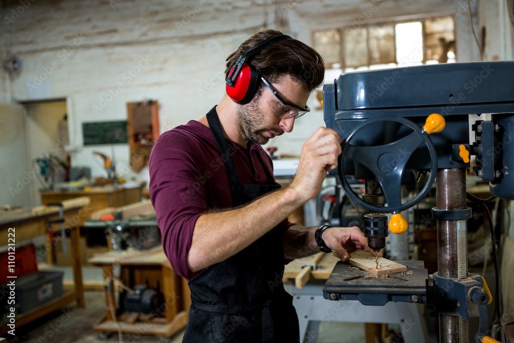 Carpenter working on his craft Carpenter working on his craft