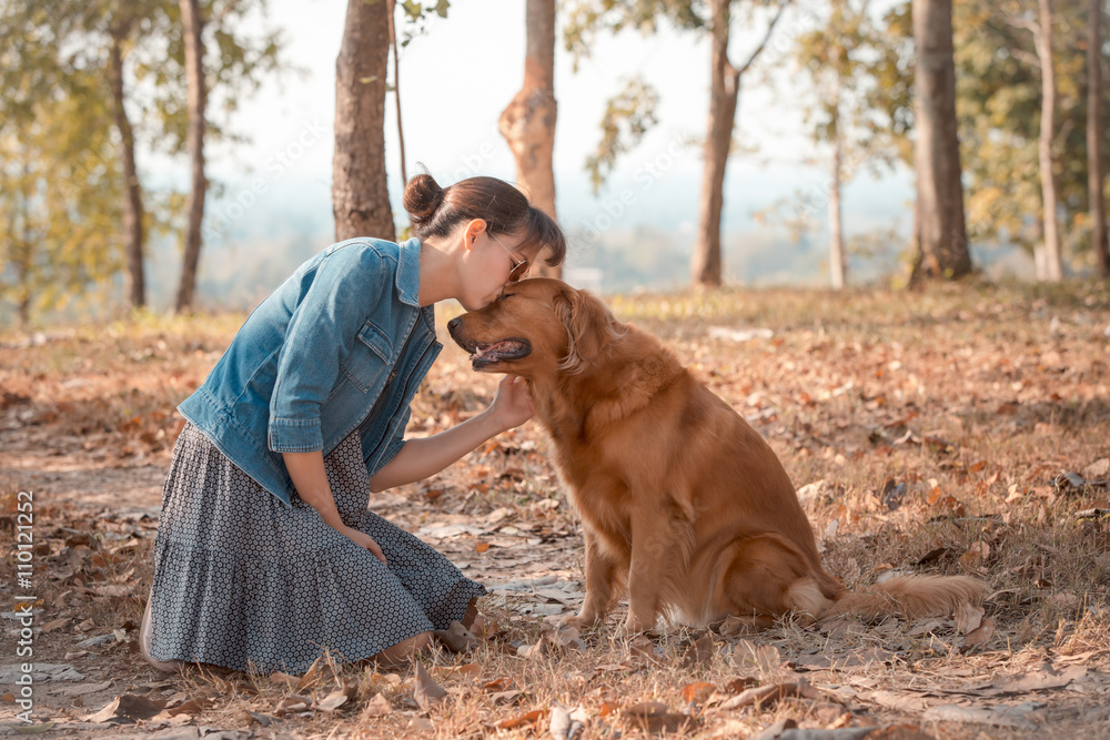 Beautiful woman with a cute golden retriever dog Beautiful woman with a cute golden retriever dog