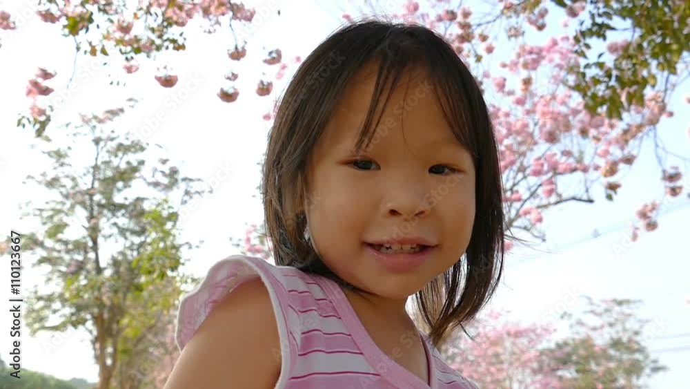 Little asian girl smiling in beautiful garden
Little asian girl smiling in beautiful garden