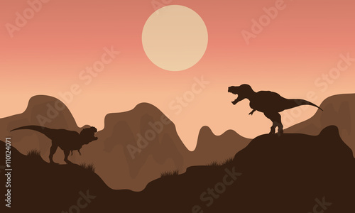 Fototapeta Naklejka Na Ścianę i Meble -  Silhouette of T-rex in cliff with sun