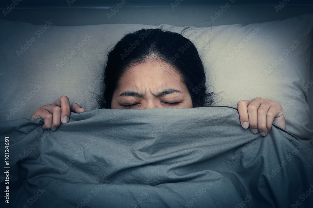 Young woman dont want to hear sound from alarm clocks. Young woman dont want to hear sound from alarm clocks.