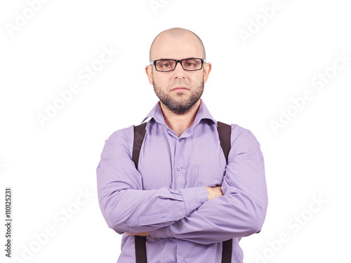 Serious bald man with arms crossed