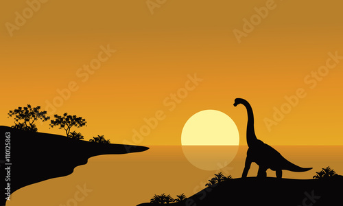 silhouette of brachiosaurus in river
