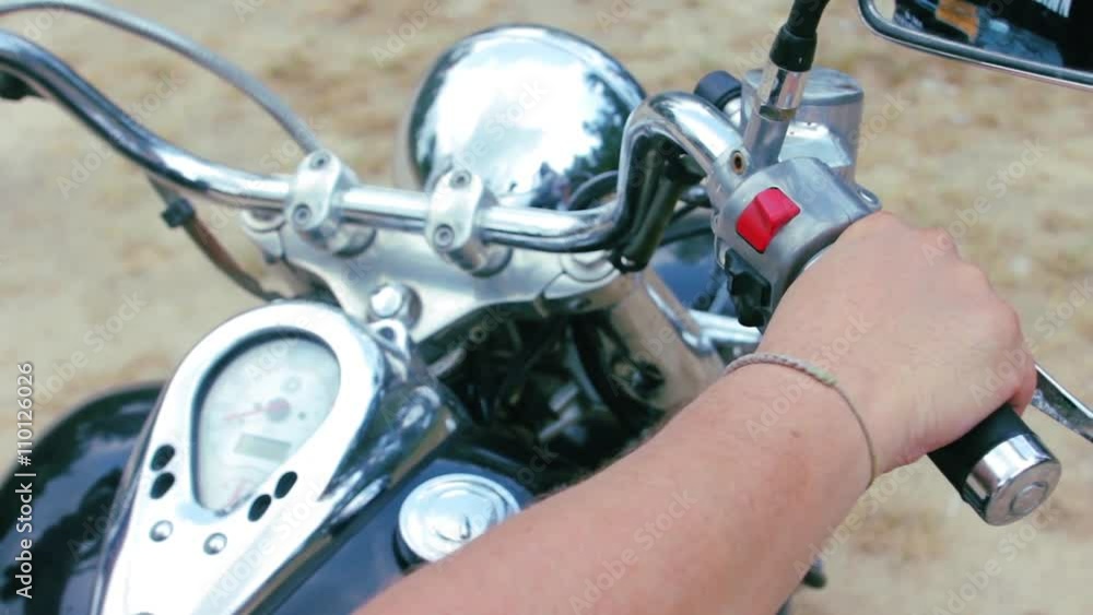 Motorbiker starting engine on chopper motorbike close up Motorbiker starting engine on chopper motorbike close up