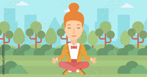 Business woman meditating in lotus pose.
