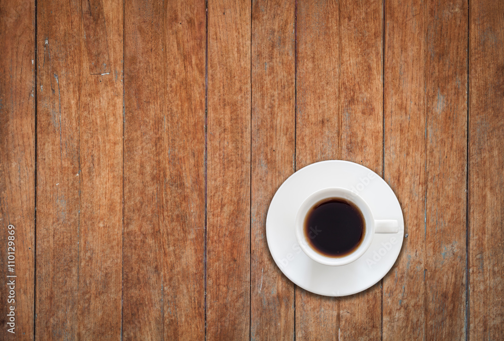 Top view of white coffee cup on wooden background Top view of white coffee cup on wooden background
