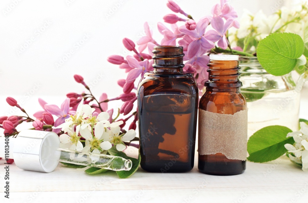 Aromatherapy bottles with essential oils. Fresh blossom. Sweet floral scent. Aromatherapy bottles with essential oils. Fresh blossom. Sweet floral scent.