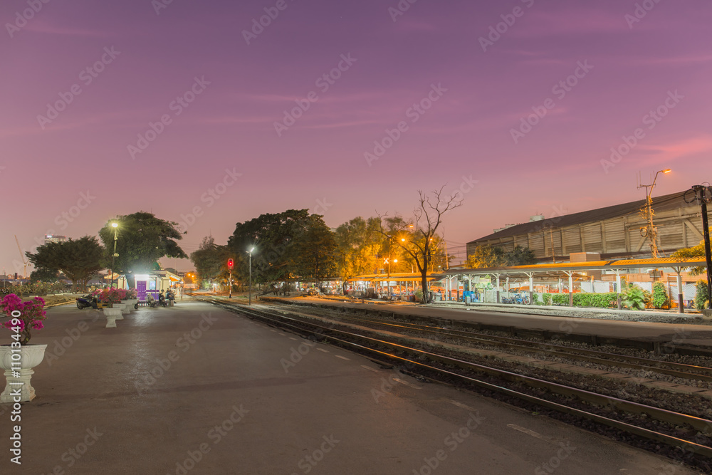 Passanger train station in the twilight.