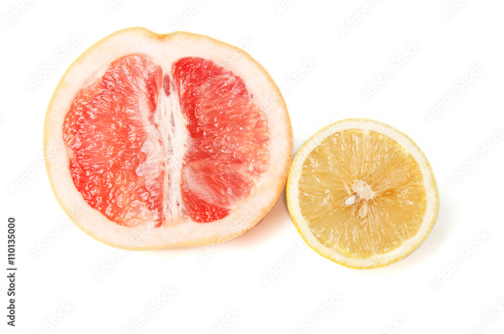 Halfes of grapefruit and lemon isolated on white