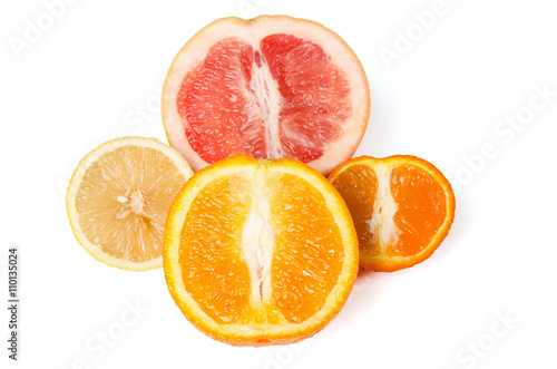 Halfes of grapefruit  orange  lemon and mandarin isolated on white